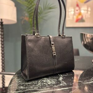 Gucci vintage Jackie black leather shoulder bag.